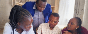 Two women and two men from Jimma University, Ethiopia, working together around a table