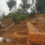 Dauson running a soil fertility test outside